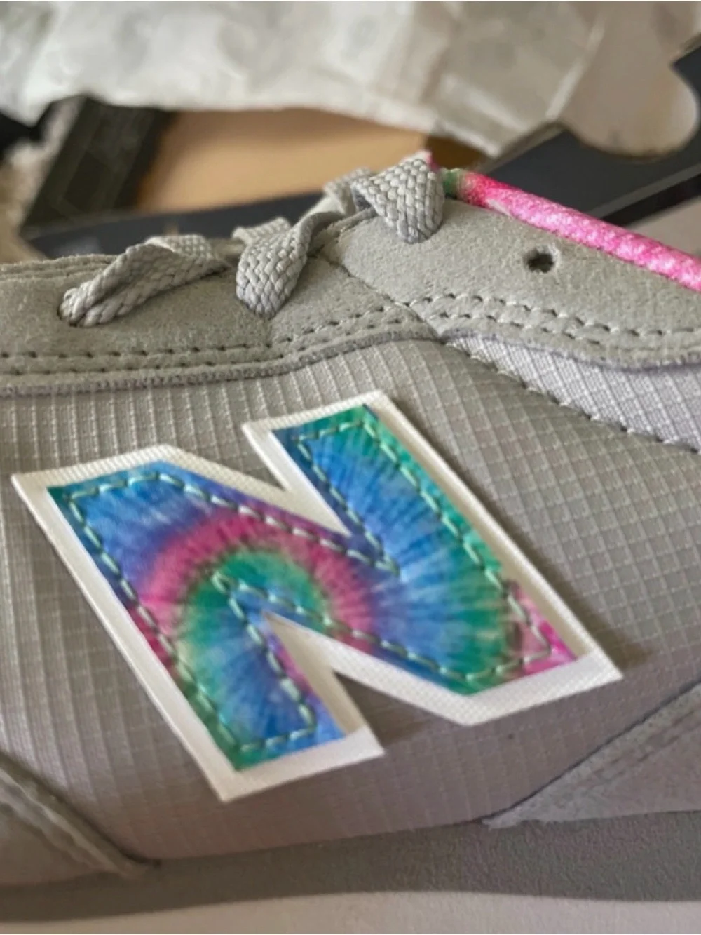 New Balance Kids Gray Sneakers with Pink and Tie-Dye Accents